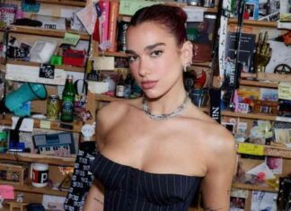 Dua Lipa Wows in Strapless Pinstripe Corset: Redefining Business Casual Style news-28102024-012043